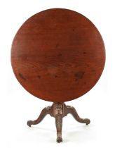 AN UNUSUAL 18TH CENTURY IRISH LARGE MAHOGANY TRIPOD TABLE WITH CARVED LEGS AND SCROLL FEET