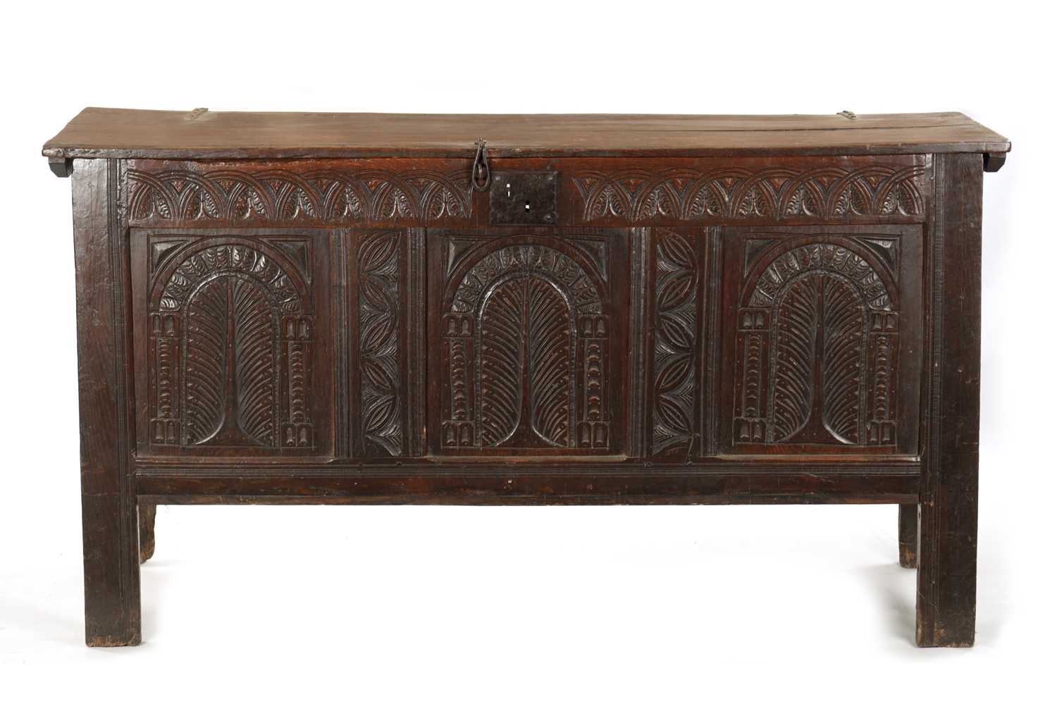 A LARGE 17TH CENTURY CARVED THREE PANELLED OAK COFFER