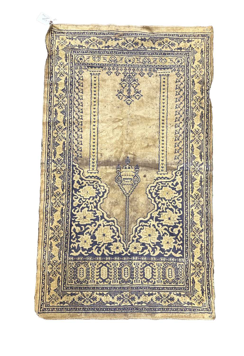 AN ANTIQUE EASTERN PRAYER RUG