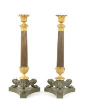 A PAIR OF REGENCY BRONZE AND ORMOLU CANDLESTICKS WITH LATER OIL LAMP FITTINGS