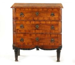 AN EARLY 18TH CENTURY ITALIAN OLIVE WOOD AND WALNUT CHEST OF DRAWERS
