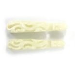 A PAIR OF LARGE 18TH / 19TH CENTURY CHINESE CARVED WHITE JADE BELT HOOKS