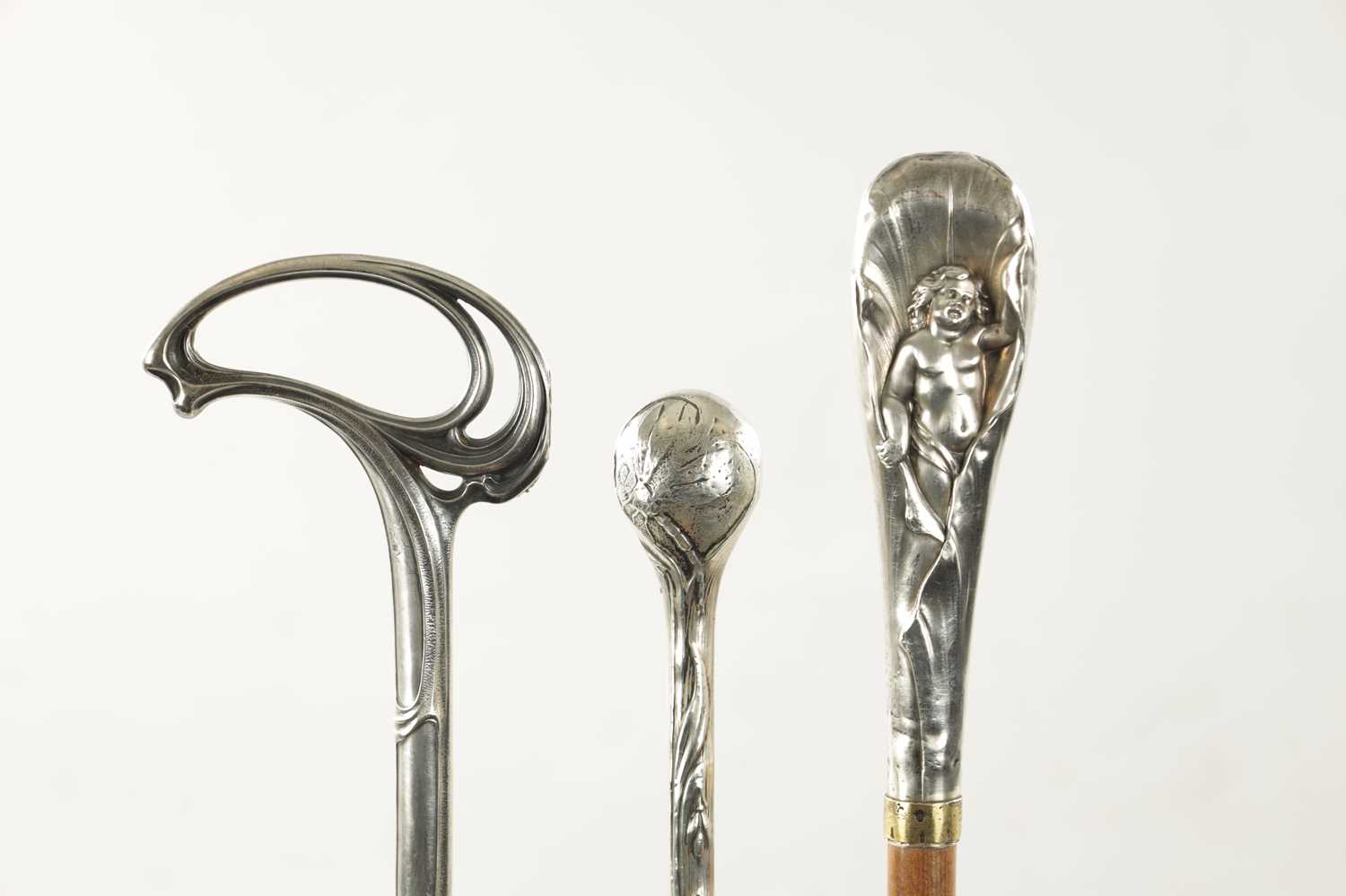 A COLLECTION OF THREE ART NOUVEAU SILVER TOPPED WALKING STICKS - Image 2 of 8