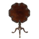 A FINE GEORGE III CHIPPENDALE CARVED MAHOGANY TILT-TOP SUPPER TABLE