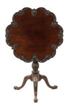 A FINE GEORGE III CHIPPENDALE CARVED MAHOGANY TILT-TOP SUPPER TABLE