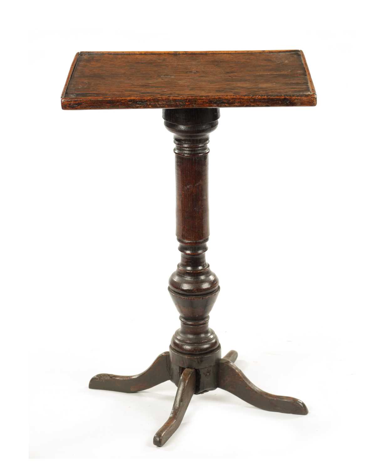 AN 18TH CENTURY PRIMITIVE OAK FOUR-LEGGED CANDLE TABLE