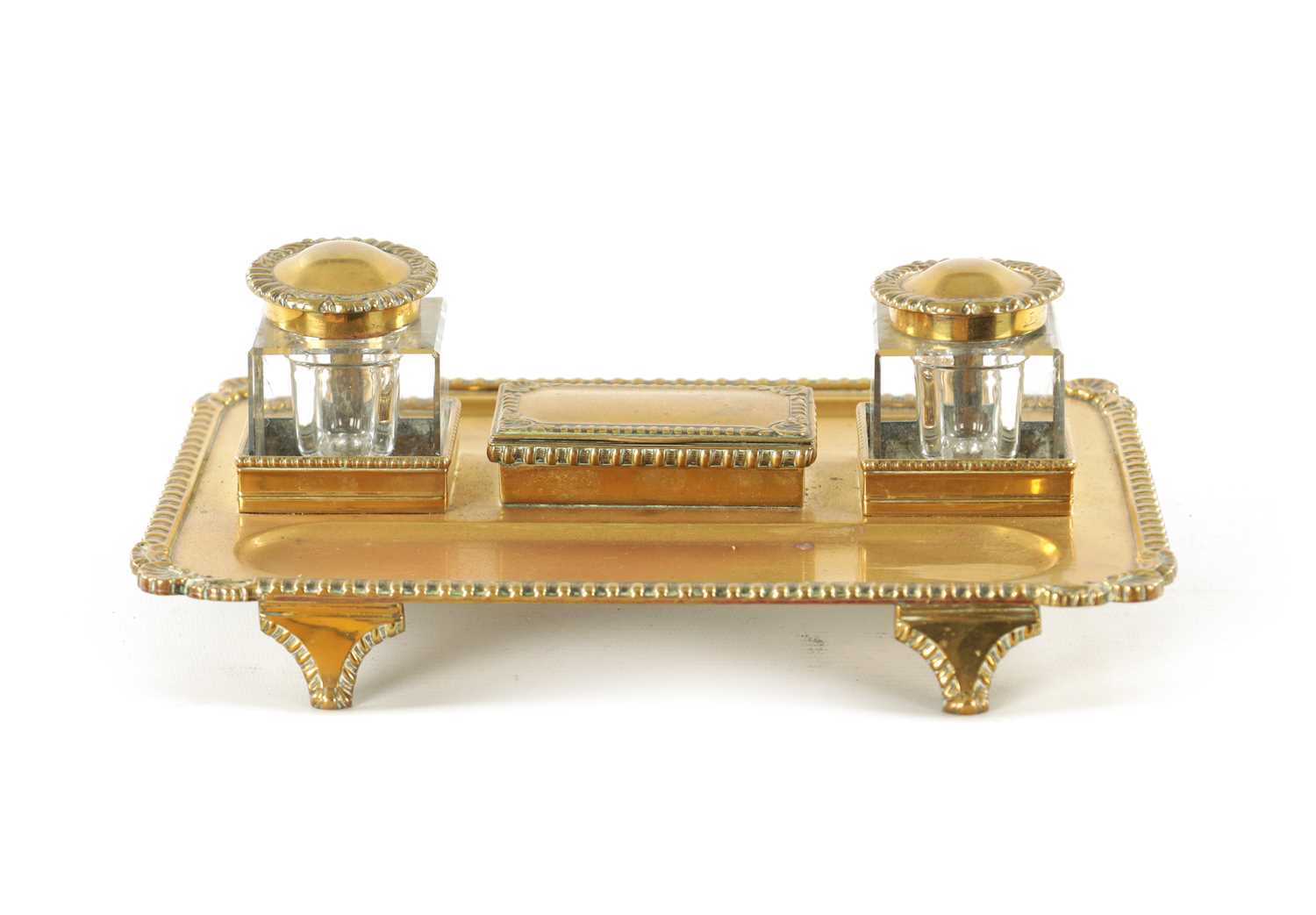 A 19TH CENTURY BRASS DESKTOP INKWELL