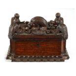 AN IMPRESSIVE 18TH CENTURY CONTINENTAL CARVED HARDWOOD TABLE CASKET
