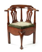 A MID 18TH CENTURY WALNUT CORNER COMMODE CHAIR OF FINE COLOUR AND PATINA