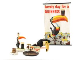 A CARLTON GUINNESS ADVERTISING TABLE LAMP, A GUINNESS ASHTRAY AND VARIOUS OTHER RELATED ITEMS