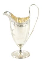 A GEORGE III HELMET STYLE SILVER CREAM JUG