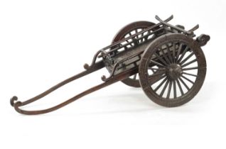 A JAPANESE MEIJI PERIOD PATINATED BRONZE MODEL OF A CARRIAGE