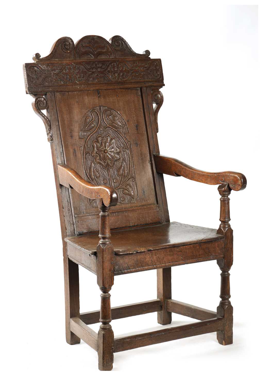 A 17TH CENTURY WAINSCOT CHAIR WITH TUDOR ROSE