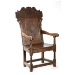 A 17TH CENTURY WAINSCOT CHAIR WITH TUDOR ROSE