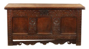 A LATE 17TH CENTURY CARVED OAK THREE PANELLED COFFER