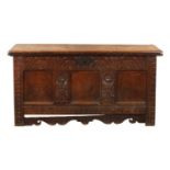 A LATE 17TH CENTURY CARVED OAK THREE PANELLED COFFER