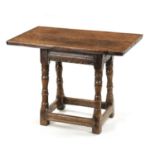 A RARE 17TH CENTURY JOINED OAK TAVERN STOOL/TABLE