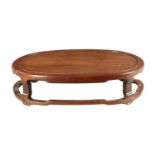 A 19TH CENTURY CHINESE HARDWOOD OVAL SHAPED JARDINIERE STAND