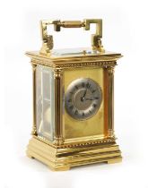 A LATE 19TH CENTURY FRENCH BRASS REPEATING CARRIAGE CLOCK