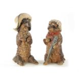 A PAIR OF LATE 19TH CENTURY AUSTRIAN COLD-PAINTED TERRACOTTA MODELS OF DOGS