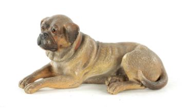 A 19TH CENTURY AUSTRIAN PAINTED TERRACOTTA SCULPTURE OF A RECUMBENT MASTIFF