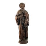 AN EARLY CARVED FIGURE OF ST. PETER