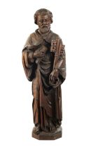 AN EARLY CARVED FIGURE OF ST. PETER