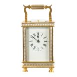 A LATE 19TH CENTURY GILT BRASS AND SILVERED REPEATING CARRIAGE CLOCK