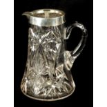 AN EARLY 20TH CENTURY CUT GLASS AND SILVER MOUNTED LEMONADE JUG