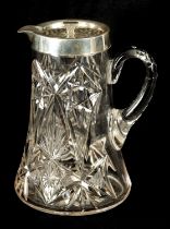AN EARLY 20TH CENTURY CUT GLASS AND SILVER MOUNTED LEMONADE JUG