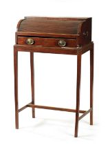 A REGENCY MAHOGANY TAMBOUR FRONT WRITING TABLE ON STAND