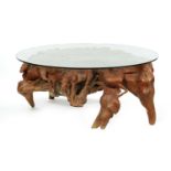 A STYLISH CARVED ROOT WOOD COFFEE TABLE