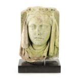 AN 18TH CENTURY CARVED STONE HEAD POSSIBLY GUINEVERE