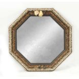 A DECORATIVE SHELLWORK HANGING MIRROR