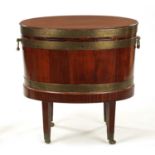 A GEORGE III OVAL MAHOGANY WINE COOLER ON STAND