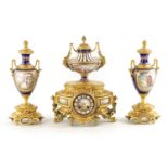 A FINE 19TH CENTURY FRENCH ORMOLU AND SEVRES PORCELAIN CLOCK GARNITURE