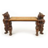 A GOOD 19TH CENTURY BLACK FOREST LINDEN WOOD CARVED BEAR HALL BENCH