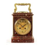 A 19TH CENTURY FRENCH GILT BRASS AND ROUGE MARBLE MANTEL CLOCK