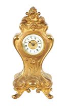 A GILT BRONZE ART NOUVEAU MANTEL CLOCK