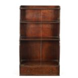 A REGENCY MAHOGANY WATERFALL BOOKCASE