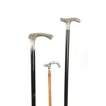 A COLLECTION OF THREE LATE 19TH CENTURY ART NOUVEAU SILVER TOPPED WALKING STICKS