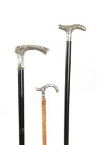 A COLLECTION OF THREE LATE 19TH CENTURY ART NOUVEAU SILVER TOPPED WALKING STICKS