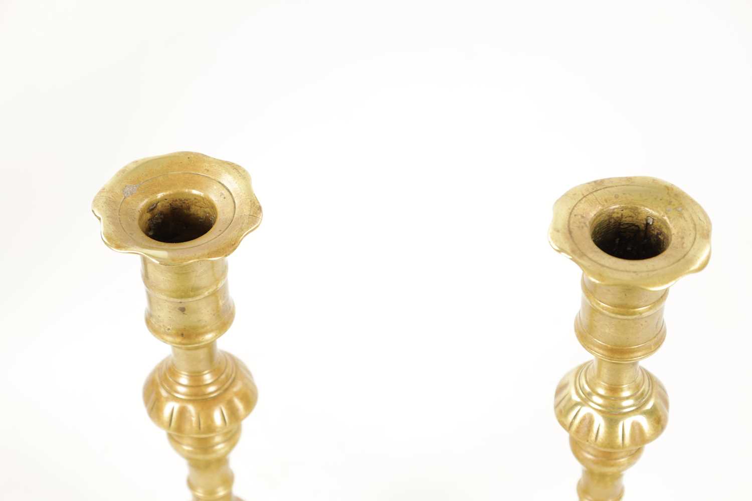 A PAIR OF MID 18TH CENTURY SEAMED CAST BRASS CANDLESTICKS - Image 5 of 8