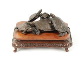 A FINE JAPANESE MEIJI PERIOD BRONZE SCULPTURE OF A GROUP OF TURTLES