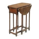 A RARE CROMWELLIAN OAK DROP LEAF GATELEG TABLE OF SMALL SIZE