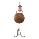 A STYLISH ARTS AND CRAFTS PLANISHED COPPER AND STEEL ADJUSTABLE STANDARD LAMP