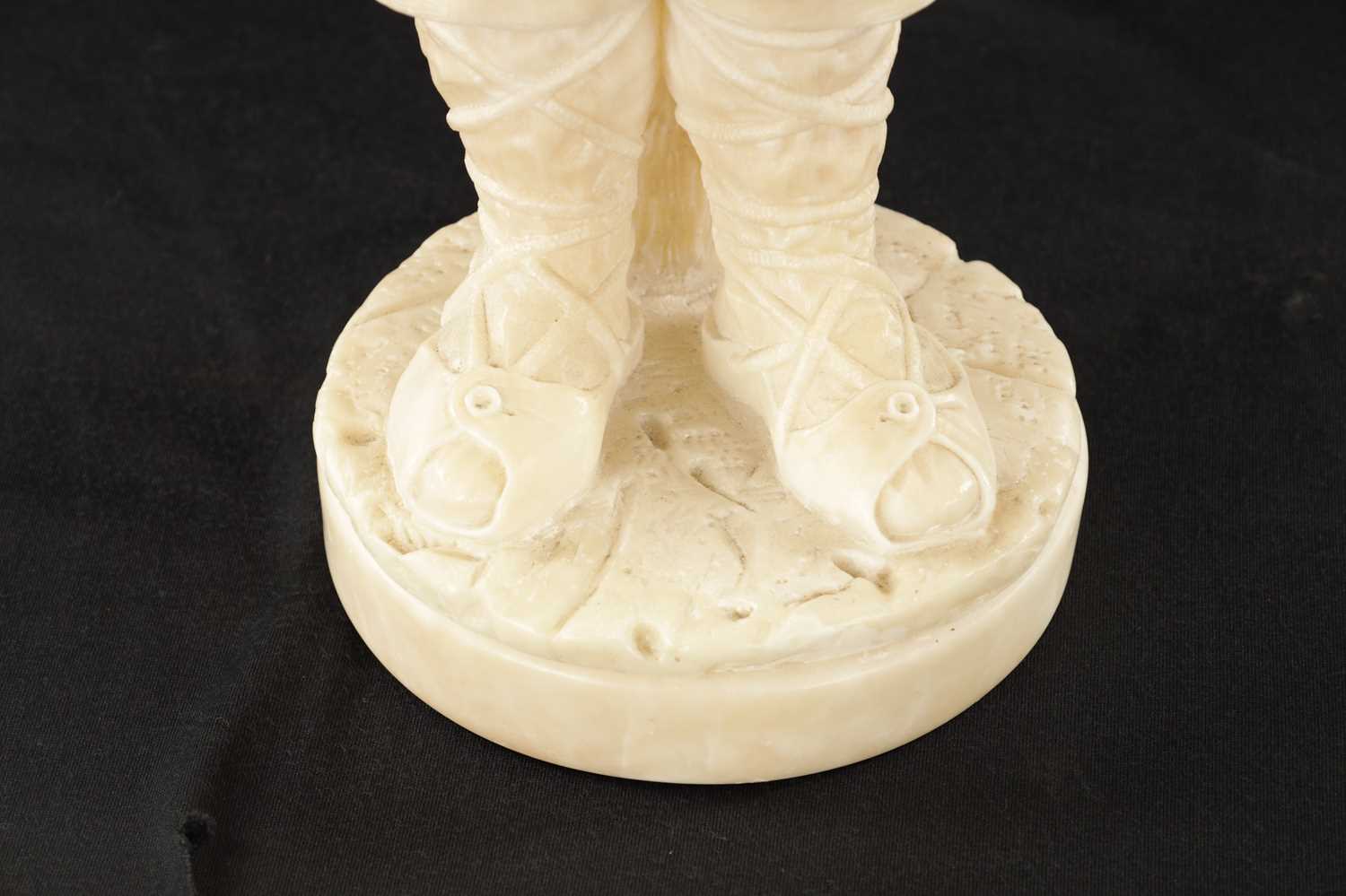 A 19TH CENTURY CARVED ALABASTER FIGURE OF A BOY PLAYING AN INSTRUMENT - Image 4 of 9