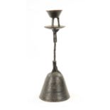 AN ANTIQUE CAST IRON TABLE CANDLESTICK