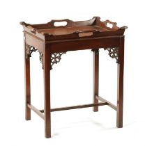 A REPRODUCTION CHIPPENDALE STYLE MAHOGANY TRAY ON STAND