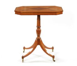 A REGENCY SATINWOOD AND AMBOYNA PANELLED OCCASIONAL TABLE